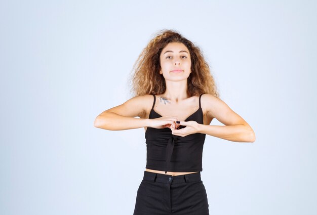 Free photo blondie woman uniting her hands as a link.