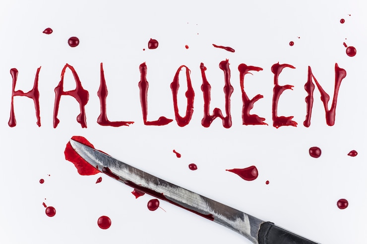 Free Photo bloody halloween word and knife 