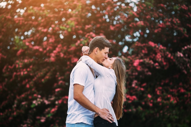 blooming outside couple female embracing