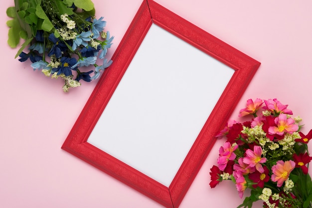 Free photo blossom flowers with frame on table