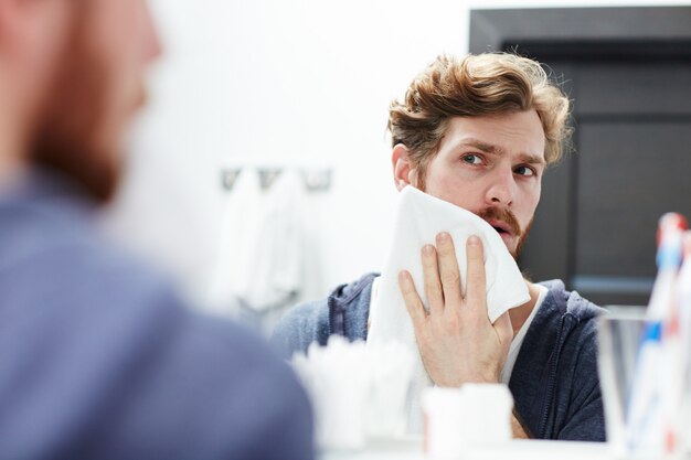 Blotting skin with towel