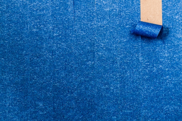 Blue adhesive wallpaper with roll-up line