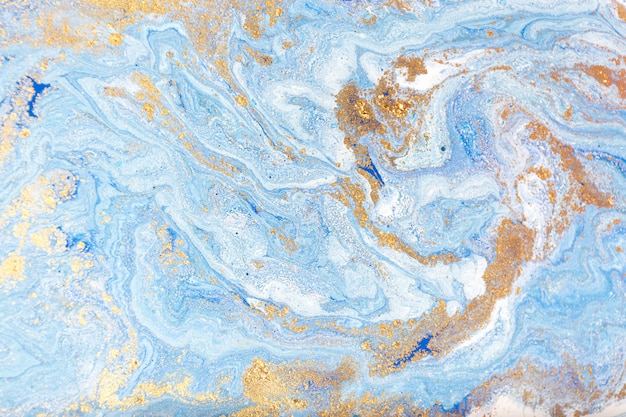 Синий и золотой мраморность. золотисто-мраморная жидкая текстура.