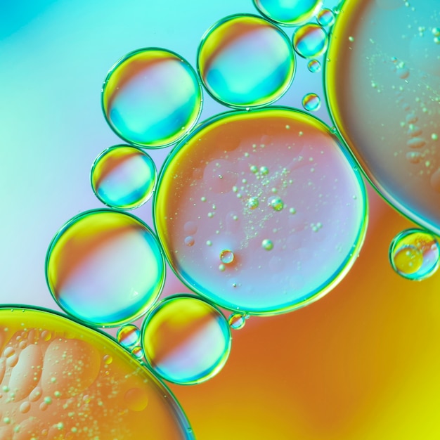 Бесплатное фото Синий и оранжевый абстрактный фон с пузырьками