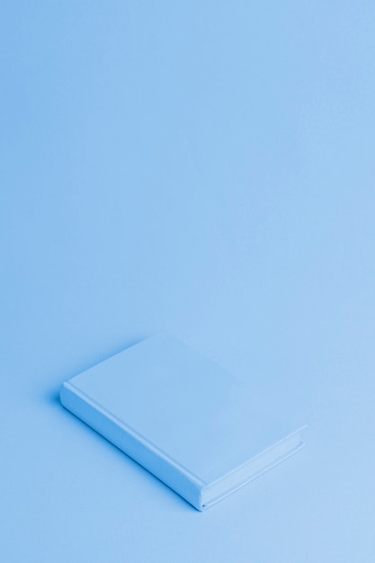 Blue background with isometric book