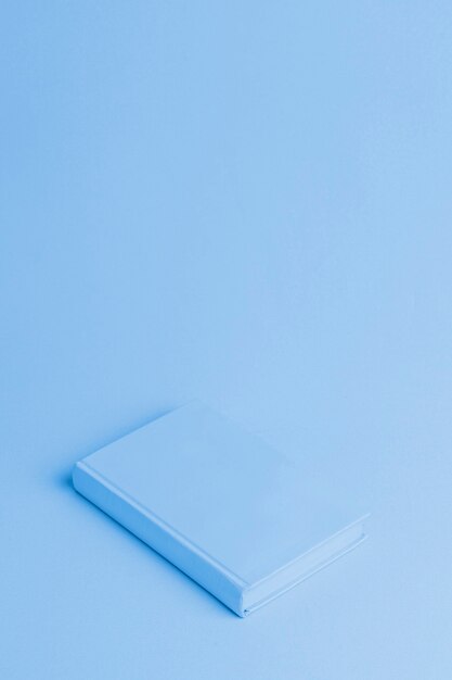 Blue background with isometric book