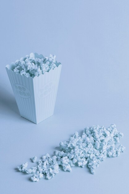 Blue background with isometric popcorn