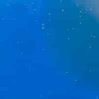 Free photo blue background with tiny bubbles