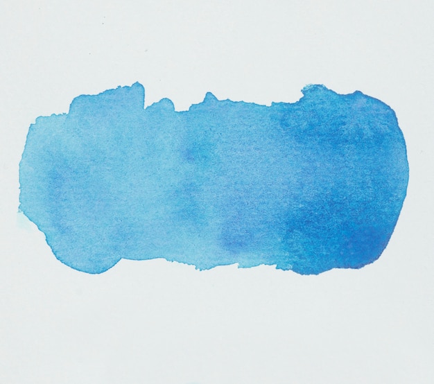 Blue blot of paints on white paper