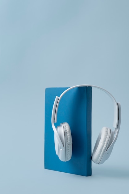 Free photo blue book and headphones assortment