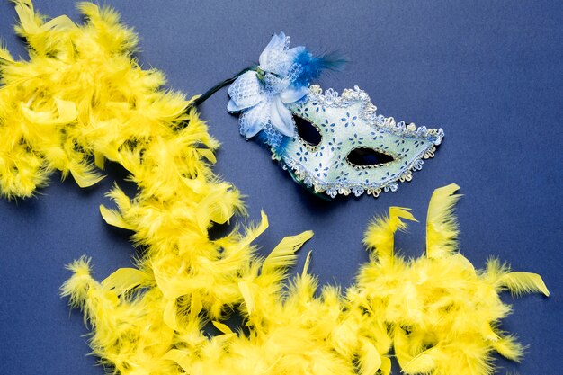 Blue carnival mask on blue background