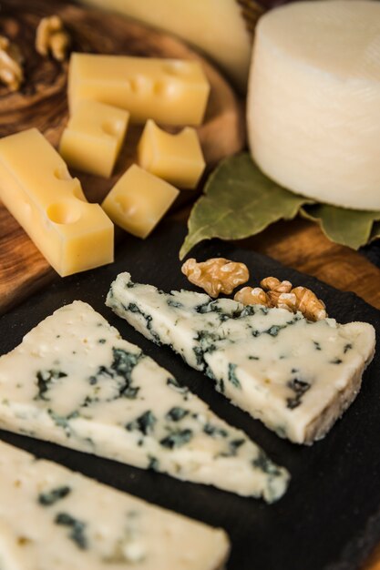 Blue cheese slice and walnut on slate