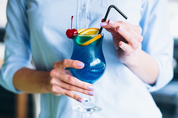 Blue cocktail with cherry