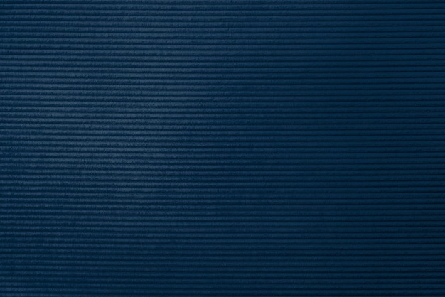 Foto gratuita fondo strutturato del tessuto di velluto a coste blu