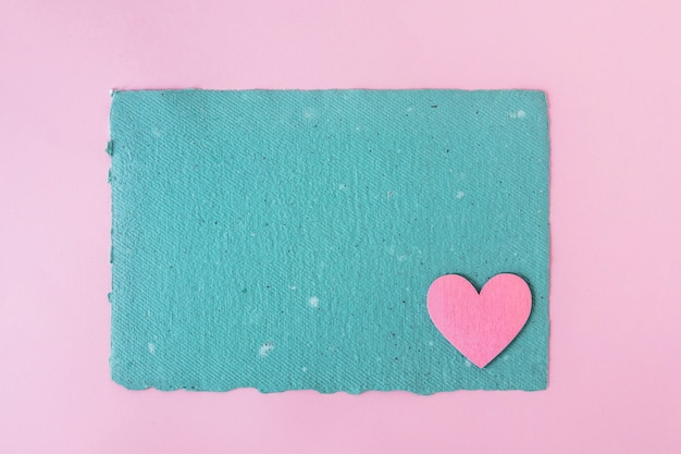 Blue craft paper and decorative heart