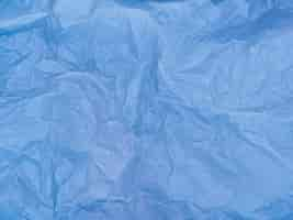 Free photo blue crumpled paper material