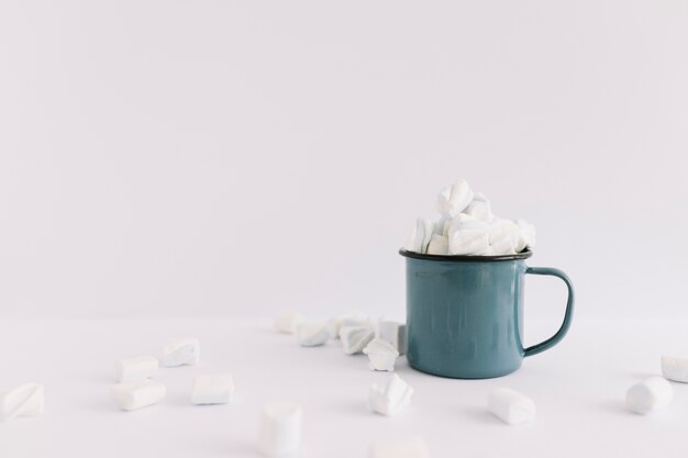 Blue cup full of marshmallows
