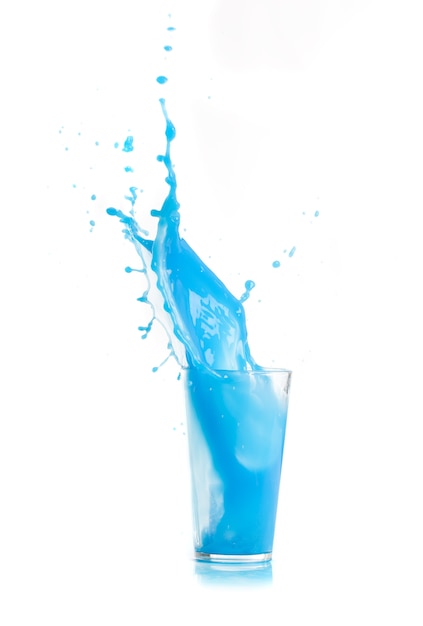 Blue drink falling in ice