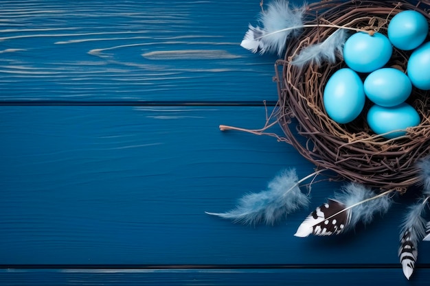 Free photo blue easter eggs inside a nest on blue wooden background top view copy space