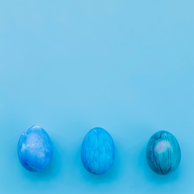 Blue eggs on blue background