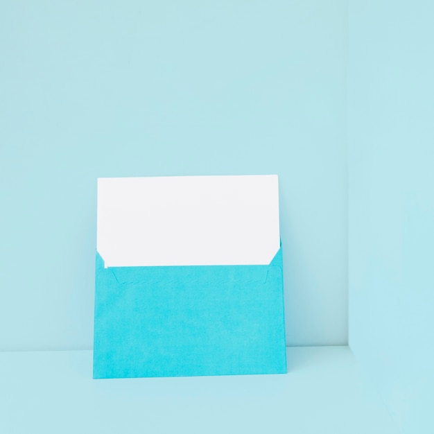 Blue envelope with blank paper inside