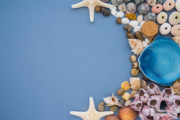 Blue fish with other decorative elements on blue surface