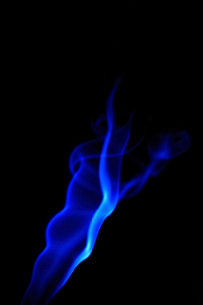 "Blue flame in darkness"