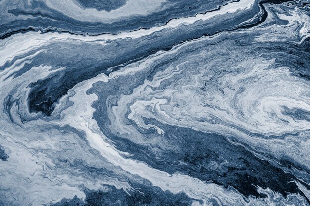 Blue fluid art marbling paint textured background