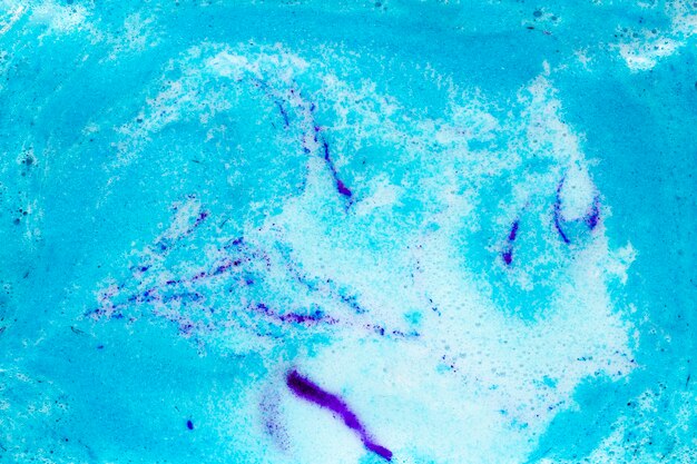 Blue foam on liquid with paint