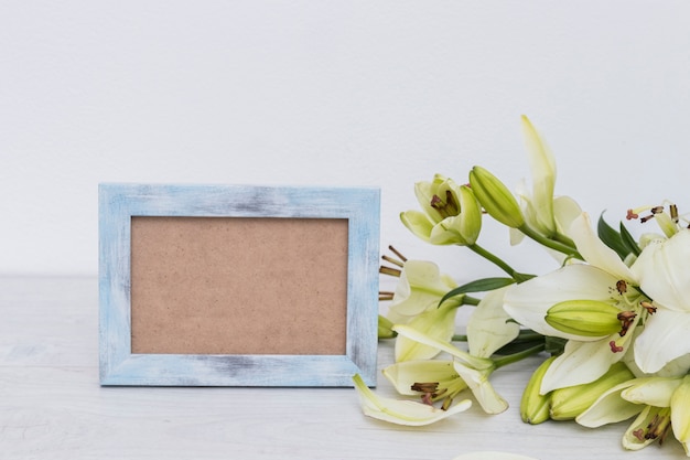 Blue frame and bunch of lilies