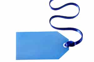 Free photo blue gift tag with a curly ribbon