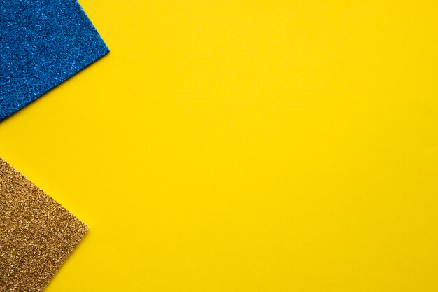 Blue and golden carpet on yellow background