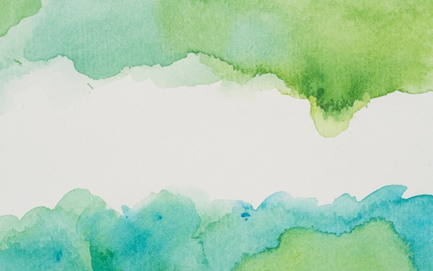 Free photo blue and green paints on white paper