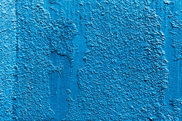 Blue grungy wall texture background with copy space