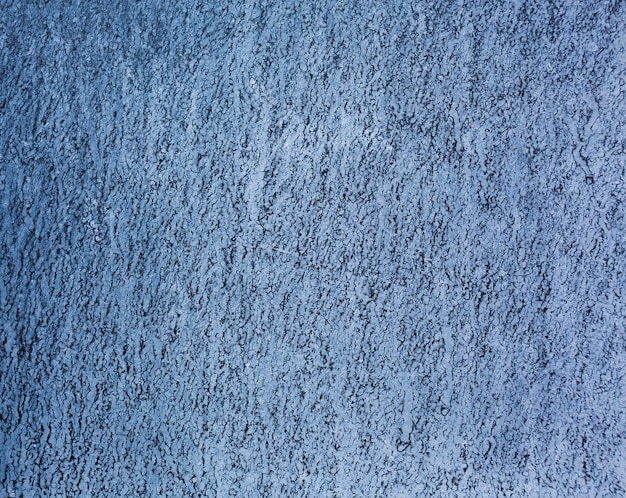 Blue grungy wall texture background with copy space
