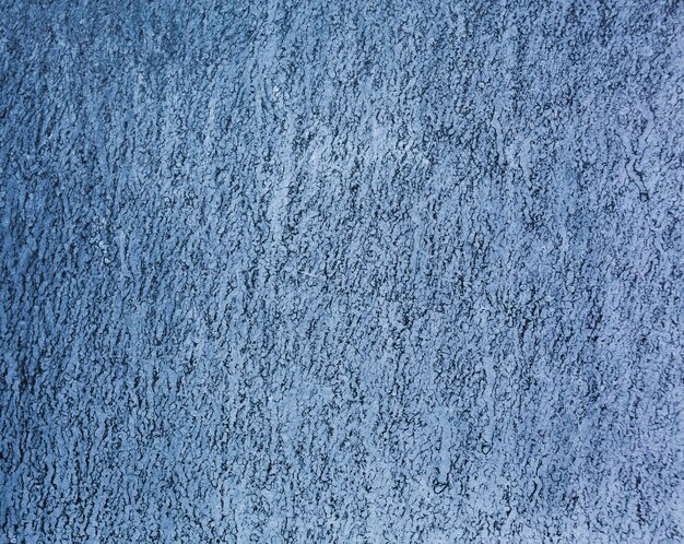 Blue grungy wall texture background with copy space