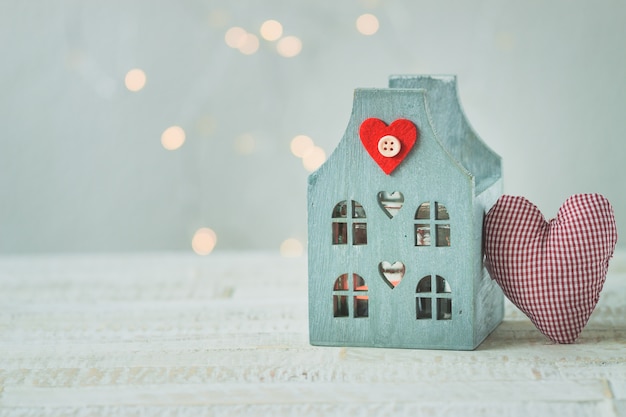 Blue house on a wooden table