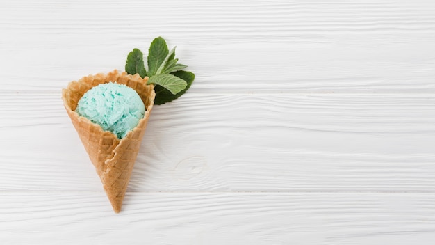 Blue ice cream scoop in wafer cone