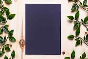 Free photo blue invitation on wooden background