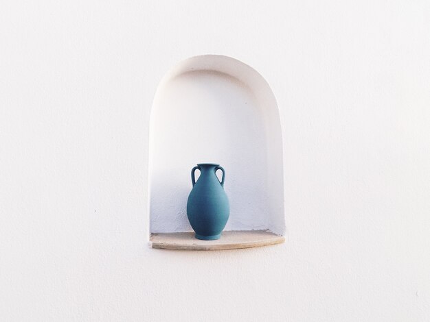 Blue jug in a white wall opening - great for a cool background