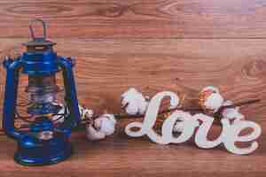 Free photo blue lamp of oil, flowers and letters of 