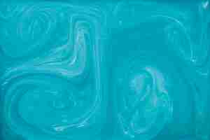 Free photo blue liquid marbling paint background