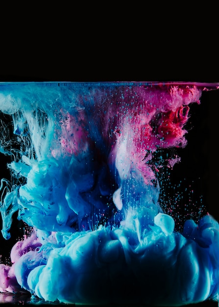 Free photo blue and magenta dyes in water