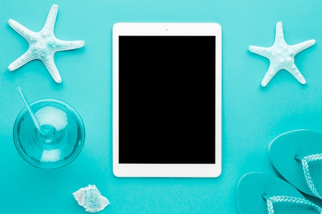 Free Photo blue marine composition with tablet
