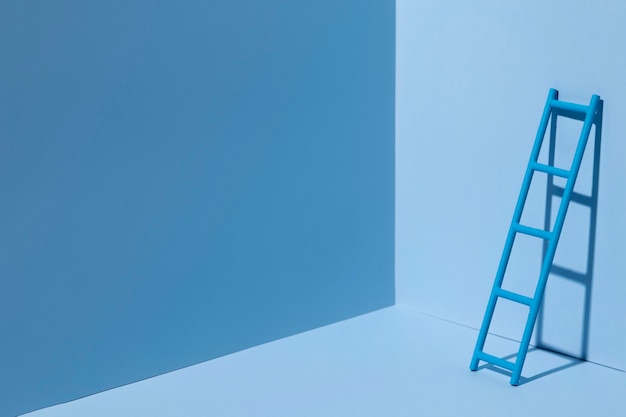 Free photo blue monday with ladder and copy space