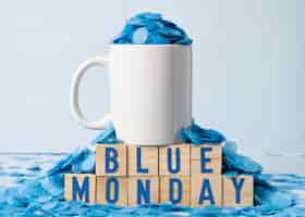 Free photo blue monday with mug and paper rain