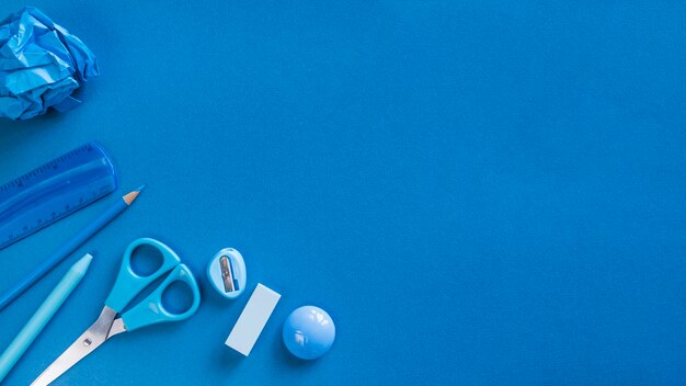 Blue office utensils on desk