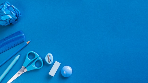 Blue office utensils on desk