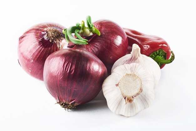 Blue onion garlic and hot red pepper isolated on white.