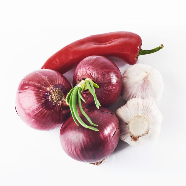 Blue onion garlic and hot red pepper isolated on white.